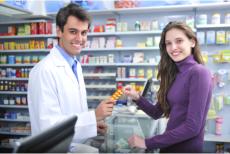woman and pharmacist man smiling